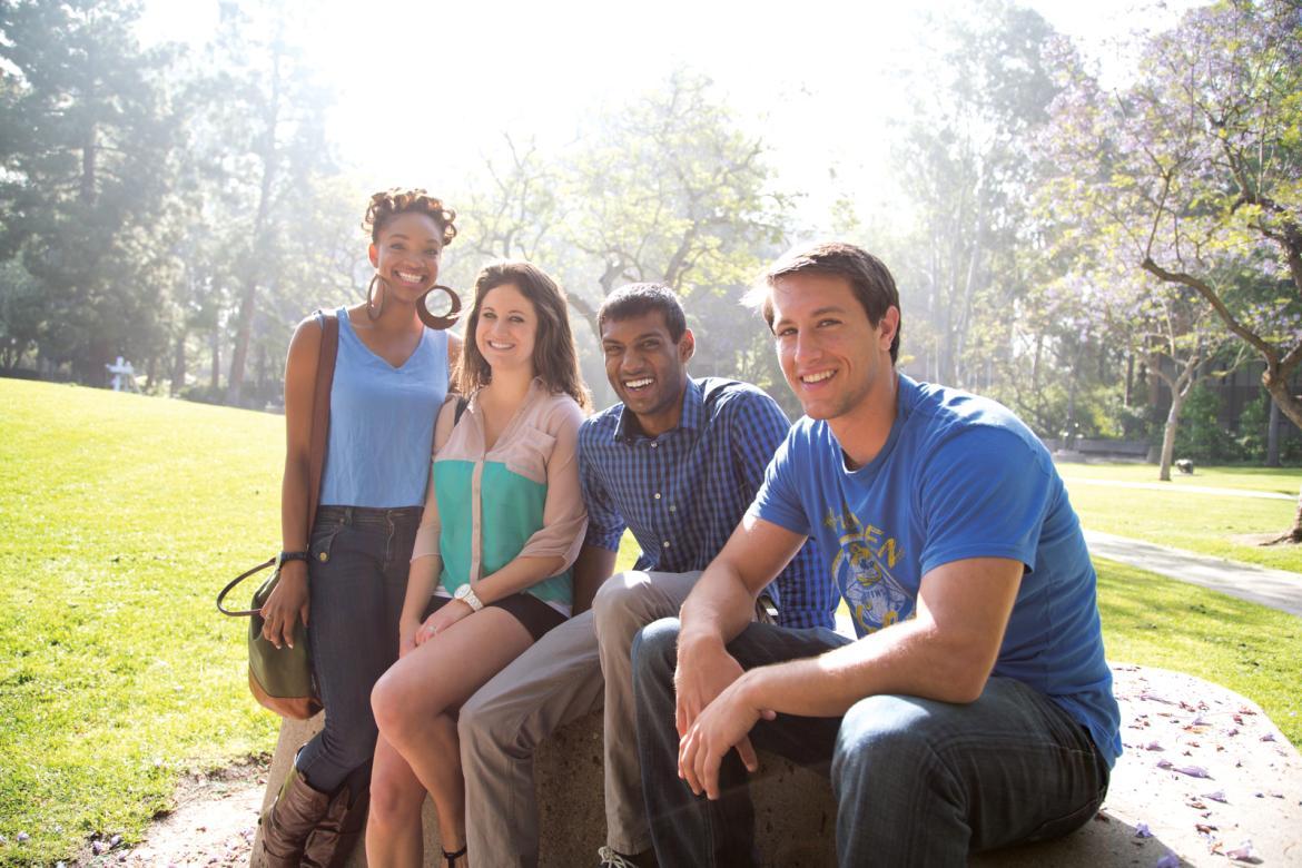 Students smiling and sitting in the UCLA Sculpture Garden