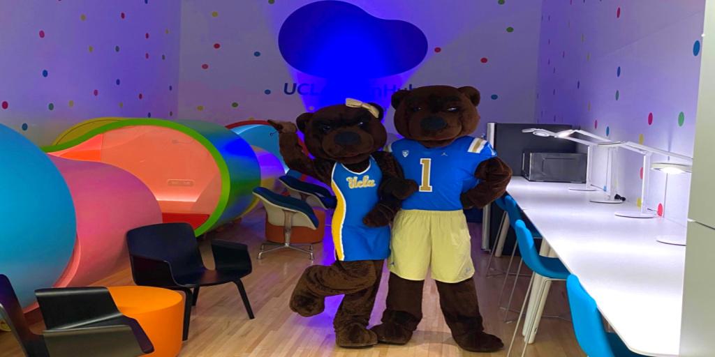 Joe and Josie Bruin standing in the BruinHub